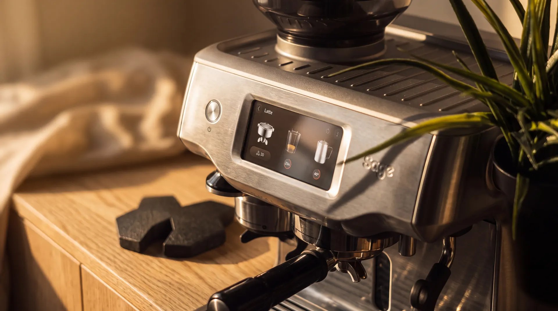 The studio espresso machine, mark-shaped coasters at hand