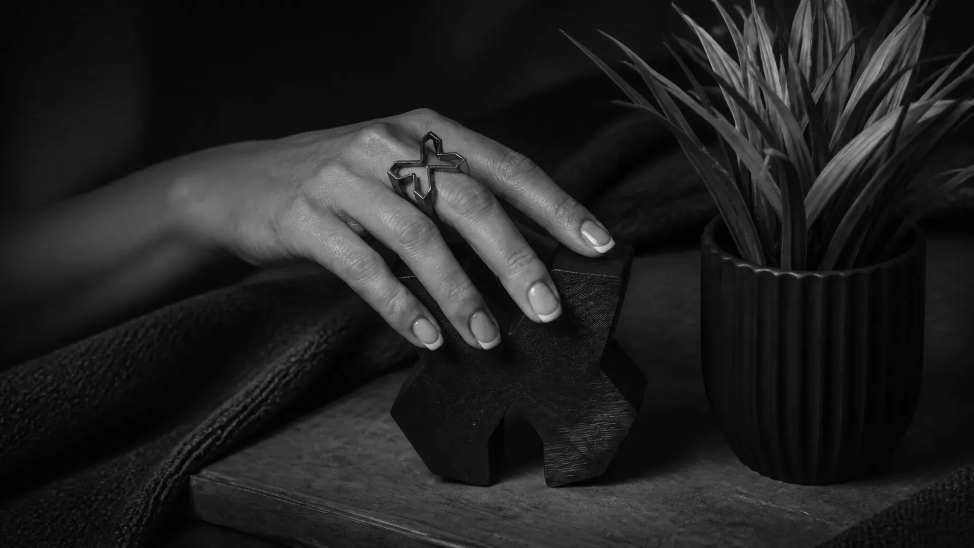 A Designco ring meets the carved mark, matte black on black
