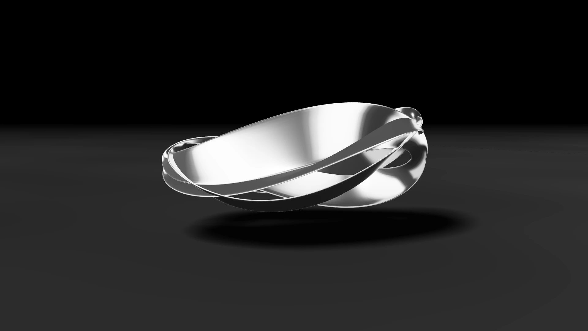 Three polished silver blades in a continuous suspended orbit